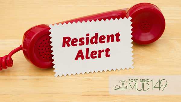 Red telephone handset on a wooden surface with a sign reading “Resident Alert” between the earpieces and the Fort Bend MUD 149 logo in the lower-right corner.